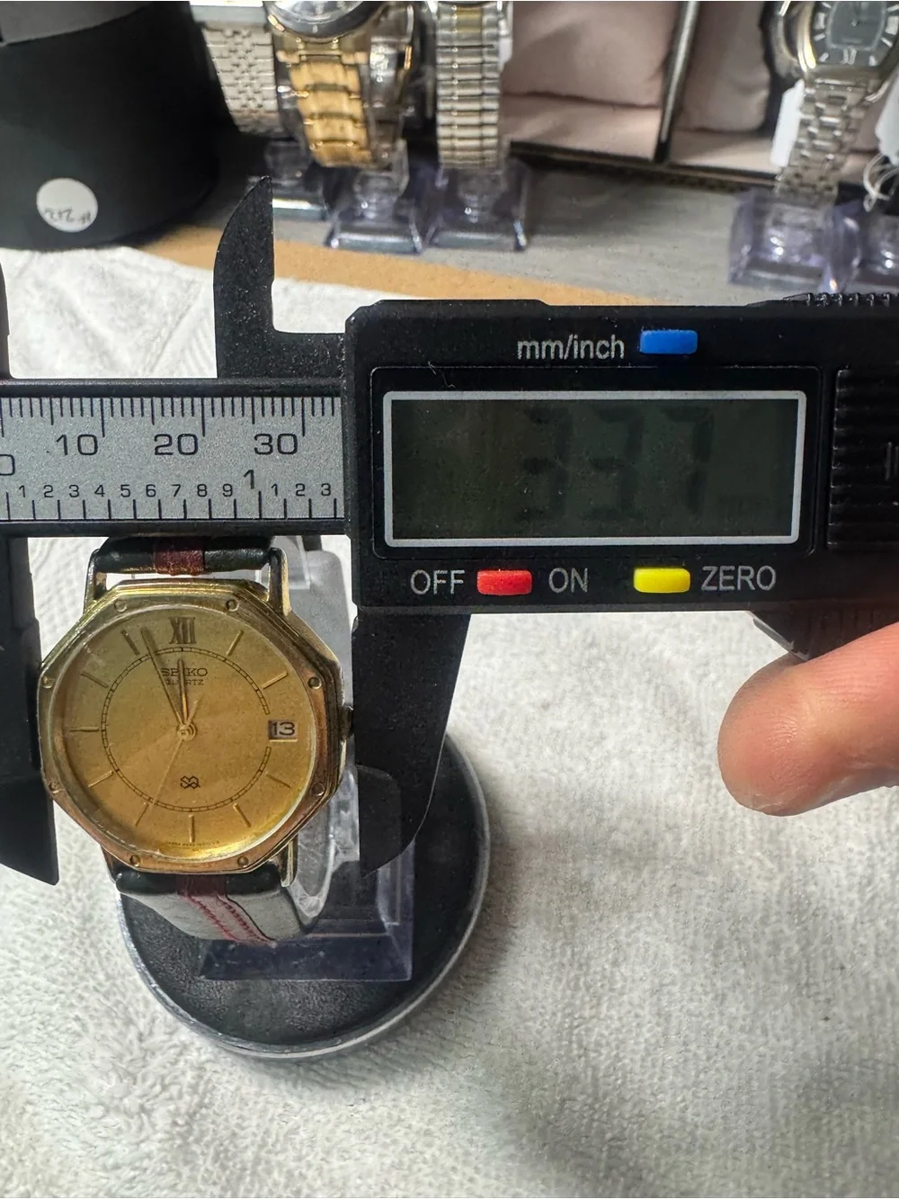 Seiko Gold Dial Watch with Black Strap and Red Stitch